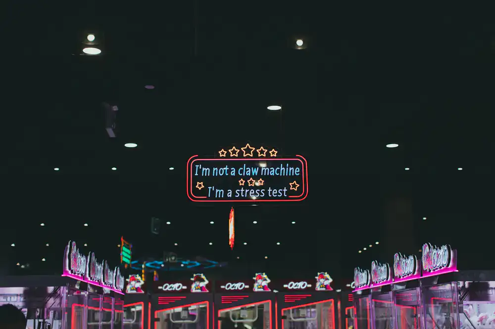 Front entrance of the arcade center with neon signs glowing