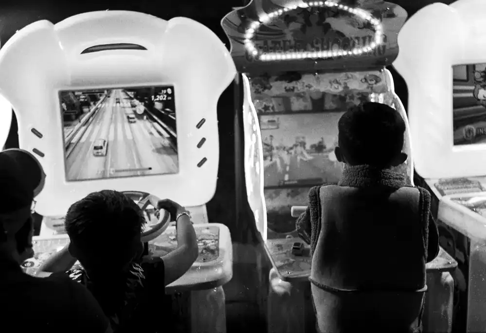 Screen showing a first place finish in a racing arcade game