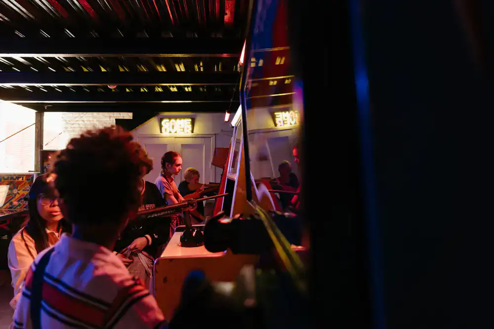 Group playing arcade games